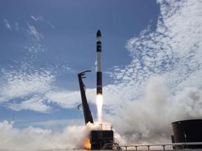 In this photo provided by Rocket Lab, Electron rocket carrying only a small payload of about 150 kilograms (331 pounds), lifts off from the Mahia Peninsula on New Zealand's North Island's east coast. The rocket launched from New Zealand on Sunday successfully reached orbit carrying small commercial satellites. (Rocket Lab via AP)