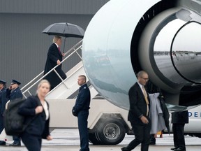 President Donald Trump boards Air Force One at Nashville International Airport in Nashville, Tenn., Monday, Jan. 8, 2018, to travel to Marietta, Ga. to attend the NCAA National Championship game.