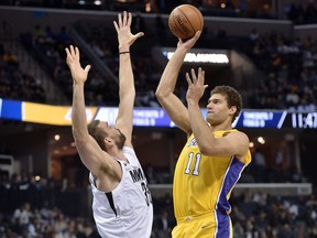 Los Angeles Lakers center Brook Lopez (11) shoots against Memphis Grizzlies center Marc Gasol (33) in the first half of an NBA basketball game Monday, Jan. 15, 2018, in Memphis, Tenn.