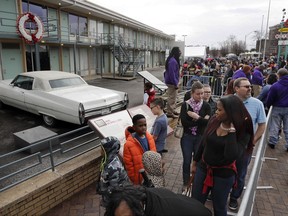 FILE - In this Monday, Jan. 16, 2017, file photo, people wait in line to enter the National Civil Rights Museum on Martin Luther King Jr. Day in Memphis, Tenn. The site is among about 130 locations in 14 states being promoted as part of the new U.S. Civil Rights Trail, which organizers hope will boost tourism in the region.