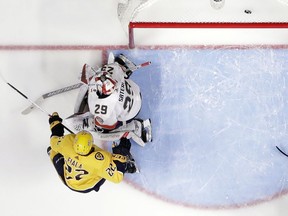 Nashville Predators left wing Kevin Fiala (22), of Switzerland, scores a goal against Florida Panthers goaltender Harri Sateri (29), of Finland, during the first period of an NHL hockey game Saturday, Jan. 20, 2018, in Nashville, Tenn.