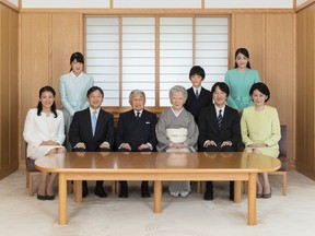 In this Nov. 4, 2017 photo provided by the Imperial Household Agency of Japan, Japan's Emperor Akihito, center left,  and Empress Michiko, center right, pose with their family members during a photo session for the New Year at the Imperial Palace in Tokyo, Japan.  Also in the picture are Crown Prince Naruhito, seated second from left,  his wife, Crown Princess Masako, seated left, their daughter, Princess Aiko, top left, Prince Akishino, seated second from right, his wife, Princess Kiko, seated right, their daughter, Princess Mako, top right, and their son, Prince Hisahito, top second from right. (The Imperial Household Agency of Japan via AP)