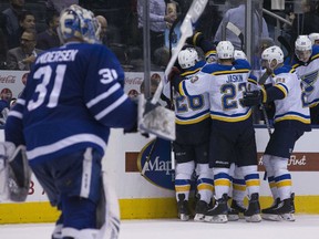 The St. Louis Blues celebrate after Vince Dunn's overtime winning goal got past the Maple Leafs' Frederik Andersen  for a 2-1 win at the Air Canada Centre, in Toronto on Tuesday night.