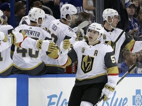 Vegas Golden Knights left wing David Perron (57) celebrates with the bench after scoring against the Tampa Bay Lightning during the second period of an NHL hockey game Thursday, Jan. 18, 2018, in Tampa, Fla.