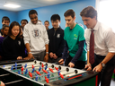 Prime Minister Justin Trudeau plays Foosball at the Dovercourt Boys and Girls Club in Toronto before announcing a doubling of the Canada Summer Jobs program on Feb. 12, 2016.