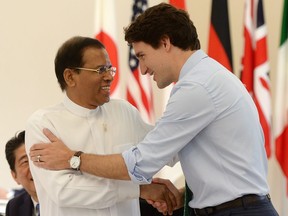 Prime Minister Justin Trudeau talks with Sri Lankan President Maithripala Sirisena as they arrive to take part in a working session with outreach partners at the G7 Summit in Shima, Japan on Friday, May 27, 2016.