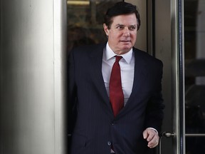 In this Nov. 6, 2017 photo, Paul Manafort, President Donald Trump's former campaign chairman, leaves the federal courthouse in Washington.