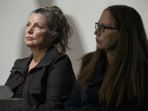 Patricia Kinsman, left,  and Karen Coles, sisters of  victim Andrew Kinsman, hold a press conference to talk about their slain brother.