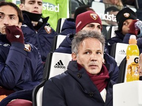 Torino's coach Sinisa Mihajlovic sits on the bench ahead of an Italian Cup quarter-final soccer match between Juventus and Torino at the Allianz Stadium in Turin, Italy, Wednesday, Jan. 3, 2018.