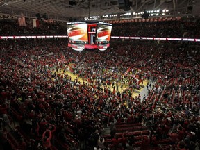 Texas Tech fans celebrate on the court after the second half of an NCAA college basketball game against West Virginia, Saturday, Jan. 13, 2018, in Lubbock, Texas.