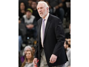 San Antonio Spurs head coach Gregg Popovich watches the action during the first half of an NBA basketball game against the Sacramento Kings, Sunday, Jan. 28, 2018, in San Antonio.