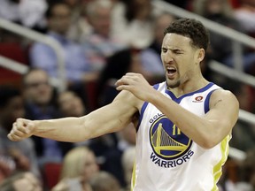 Golden State Warriors' Klay Thompson reacts after making a 3-point basket during the second half of an NBA basketball game against the Houston Rockets Thursday, Jan. 4, 2018, in Houston. The Warriors won 124-114.