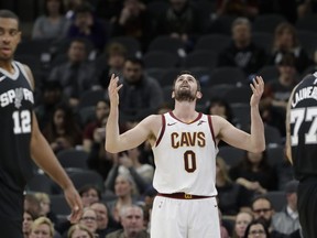 Cleveland Cavaliers forward Kevin Love (0) reacts after he was called for a personal foul against San Antonio Spurs forward LaMarcus Aldridge (12) during the first half of an NBA basketball game, Tuesday, Jan. 23, 2018, in San Antonio.