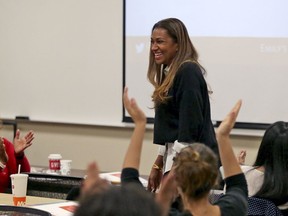 In this Saturday, Dec. 9, 2017 photo, Letitia Plummer, a Houston dentist and candidate for Congress to represent Texas District 22, is applauded during a women's candidate training workshop at El Centro College in Dallas. EMILY'S List, an organization dedicated to electing candidates at all levels of government who support abortion rights, is conducting a national recruitment effort looking to train candidates and potential candidates in over 20 states.