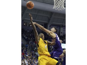 West Virginia guard Daxter Miles Jr. (4) goes up to shoot against TCU guard Alex Robinson (25) in the first half of an NCAA college basketball game in Fort Worth, Texas, Monday, Jan. 22, 2018.