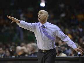 Texas Head coach Shaka Smart calls in an offensive play against Baylor in the first half of an NCAA college basketball game, Saturday, Jan. 6, 2018, in Waco, Texas.