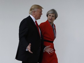 Jan. 27, 2017, U.S. President Donald Trump and Britain's Prime Minister Theresa May walk along the colonnades of the White House in Washington.