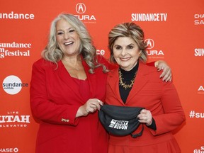 Producer Marta Kauffman, left, and attorney Gloria Allred, right, pose at the premiere of "Seeing Allred" during the 2018 Sundance Film Festival on Sunday, Jan. 21, 2018, in Park City, Utah.