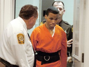 FILE - In this Oct. 26, 2004, file photo, Lee Boyd Malvo enters a courtroom in the Spotsylvania, Va., Circuit Court. A federal appeals court is set to hear arguments Tuesday, Jan. 22, 2018, in a case focusing on the life sentences given to D.C. sniper Malvo. A federal judge in Virginia found that Malvo is entitled to new sentencing hearings in light of a U.S. Supreme Court ruling that mandatory life sentences for juveniles are unconstitutional. Malvo was 17 when he was arrested in a series of random shootings that killed 10 people and wounded three in Virginia, Maryland and the District of Columbia in 2002.