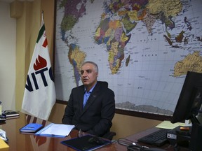 Mohsen Bahrami, a spokesman for National Iranian Tanker Company, NITC, speaks during an interview with The Associated Press at the headquarters of the NITC, in Tehran, Iran, Tuesday, Jan. 9, 2018. The Iranian company whose oil tanker burst into flames after a collision in the East China Sea says there is still hope of finding survivors.