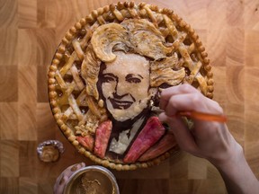 Jessica Clark-Bojin puts the finishing touches on an apple pie that she made bearing a likeness of actor and comedian Betty White, at her home in Vancouver, B.C., on Thursday January 25, 2018. Clark-Bojin remembers at one time having a reputation for her lack of cooking skills."I couldn't crack an egg. I was shooed out at family gatherings," says the Vancouver native, laughing. "I had no experience in a kitchen whatsoever."