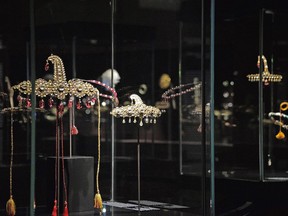 Some jewels are on display at the 'Treasures of the Mughals and the Maharajahs' exibithion, at Venice's Doge's Palace, in Venice, Italy, Wednesday, Jan. 3, 2018. News reports say thieves stole precious Indian jewels from the famed Al Thani Collection that were on exhibit, the thieves grabbed a golden, jeweled brooch and a pair of earrings Wednesday and escaped by blending in with the crowd and delaying the triggering of the alarm.