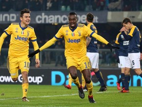 Juventus' Blaise Matuidi celebrates with his teammate Paulo Dybala, left, after scoring during the Serie A soccer match between Hellas Verona and  Juventus, at the Bentegodi stadium in Verona, Italy, Saturday, Dec. 30, 2017.