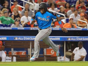 Vladimir Guerrero Jr. of the World Team comes in to score against the U.S. Team during the SiriusXM All-Star Futures Game at Marlins Park on July 9, 2017