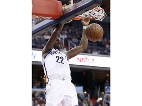 Brooklyn Nets guard Caris LeVert (22) dunks the ball during the first half of an NBA basketball game against the Washington Wizards, Saturday, Jan. 13, 2018, in Washington.