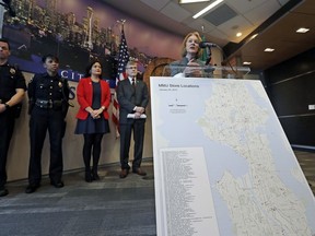Seattle Mayor Jenny Durkan stands behind a map of pot shops in the city as she talks about a Trump administration move that could lead to a federal crackdown on marijuana sales in states that have legalized the drug Thursday, Jan. 4, 2018, in Seattle. Attorney General Jeff Sessions has rescinded an Obama-era policy that paved the way for legalized marijuana to flourish in states across the country, creating new confusion about enforcement and use just three days after a new legalization law went into effect in California.