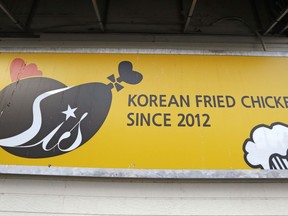 In this photo taken Dec. 12, 2017, a sign for Stars In the Sky, a popular Korean-style fried chicken shop, stands outside the restaurant in Edmonds, Wash. Southern foods such as fried chicken and moon pie have made lasting impressions on the Korean diet, just as the U.S. military has historically included a large percentage of its recruits from the Southern U.S.