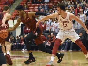 Stanford forward Kezie Okpala (0) steals the ball away from Washington State forward Drick Bernstine (43) during the first half of an NCAA college basketball game, Thursday, Jan. 11, 2018, in Pullman, Wash.