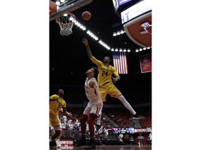 California forward Marcus Lee (24) shoots over Washington State forward Drick Bernstine (43) during the first half of an NCAA college basketball game in Pullman, Wash., Saturday, Jan. 13, 2018.