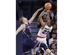 Gonzaga guard Zach Norvell Jr. (23) shoots against Saint Mary's center Jock Landale during the first half of an NCAA college basketball game in Spokane, Wash., Thursday, Jan. 18, 2018.
