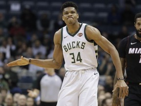 Milwaukee Bucks' Giannis Antetokounmpo reacts after a 24-second violation during the first half of an NBA basketball game against the Miami Heat Wednesday, Jan. 17, 2018, in Milwaukee.