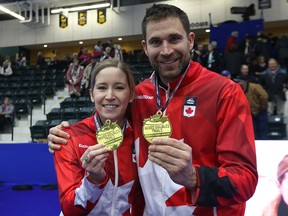 Kaitlyn Lawes and John Morris display their gold medals after winning the mixed doubles Olympic trials final over Brad Gushue and Val Sweeting in Portage la Prairie, Man., on Sun., Jan. 7, 2018. Kevin King/Winnipeg Sun/Postmedia Network