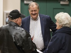 Former Massey CEO and West Virginia Republican Senatorial candidate, Don Blankenship, greets supporters, Doug Smith, left, of Chapmanville, W.Va., and Wanda Smith, right, of prior to a town hall in Logan, W.Va., Thursday, Jan. 18, 2018. Blankenship will face two other republican candidates in the May 8, 2018, primary.
