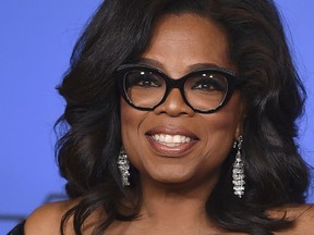 FILE - In this Jan. 7, 2018, file photo, Oprah Winfrey poses in the press room with the Cecil B. DeMille Award at the 75th annual Golden Globe Awards in Beverly Hills, Calif. Oprah Winfrey says she's not interested in a presidential bid despite Democrats' continuing buzz about the billionaire media icon.