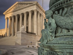 The Supreme Court in Washington is seen at sunset, Tuesday, Oct. 10, 2017. The Supreme Court is giving a Georgia death row inmate who came within minutes of being executed another chance to raise claims of racial bias on his jury. The justices voted 6-3 Monday to order the federal appeals court in Atlanta to take up the case of inmate Keith Leroy Tharpe.