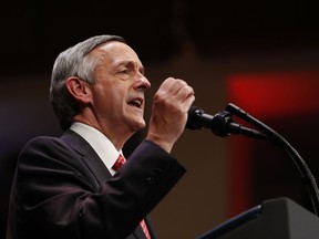 FILE - In this July 1, 2017, file photo, Pastor Robert Jeffress of the First Baptist Dallas Church Choir speaks as he introduces President Donald Trump during the Celebrate Freedom event at the Kennedy Center for the Performing Arts in Washington. A few of President Donald Trump's leading evangelical supporters defended him after he questioned why the U.S. should accept more immigrants from Haiti and "shithole countries" in Africa. However, many other evangelicals condemned his remarks, citing their increasing devotion to fellow Christians overseas, along with the large numbers of immigrants in U.S. churches and their families.