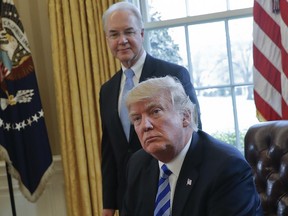 FILE - In this March 24, 2017, file photo, President Donald Trump with Health and Human Services Secretary Tom Price are seen in the Oval Office of the White House in Washington.