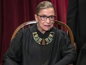 FILE - In this June 1, 2017, file photo, Associate Justice Ruth Bader Ginsburg joins other justices of the U.S. Supreme Court for an official group portrait at the Supreme Court Building in Washington. In different circumstances, Ginsburg might be on a valedictory tour in her final months on the Supreme Court. But in the era of Donald Trump, the 84-year-old Ginsburg is packing her schedule and sending signals she intends to keep her seat on the bench for years.