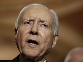 FILE - In this Dec. 19, 2017, file photo, Sen. Orrin Hatch, R-Utah, speaks on Capitol Hill in Washington. Hatch says he is retiring after four decades in Senate