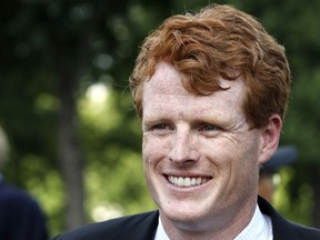 FILE - In this July 26, 2017, file photo, Rep. Joe Kennedy, D-Mass., smiles on Capitol Hill in Washington. Kennedy, grandson of Robert F. Kennedy, will give the Democratic response to President Donald Trump's State of the Union speech.