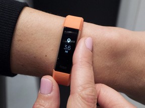 FILE - In this March 1, 2017, file photo, Fitbit's new Alta HR device is displayed in New York. The Pentagon is doing a broad review of how military forces use exercise trackers and other wearable electronic devices in the wake of revelations that an interactive, online map can pinpoint troop locations, bases and other sensitive areas around the world.