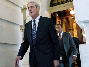 FILE - In this June 21, 2017, file photo, former FBI Director Robert Mueller, the special counsel probing Russian interference in the 2016 election, departs Capitol Hill following a closed door meeting in Washington.