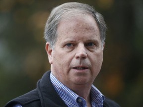 FILE - In this Dec. 4, 2017, file photo, then-Democratic senatorial candidate Doug Jones speaks at a news conference in Dolomite, Ala. Jones, the first Alabama Democrat elected to the Senate in a quarter century, is one of two new members who will take the oath of office on the Senate floor at noon on Jan. 3, 2018.