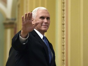 FILE - In this Jan. 3, 2018, file photo, Vice President Mike Pence waves as he walks on Capitol Hill in Washington. Pence is making his fifth visit to Israel, returning to a region he's visited "a million times" in his heart. An evangelical Christian with strong ties to the Holy Land, Pence this time comes packing two key policy decisions in his bags that have long been top priorities for him: designating Jerusalem as Israel's capital and curtailing aid for Palestinians.