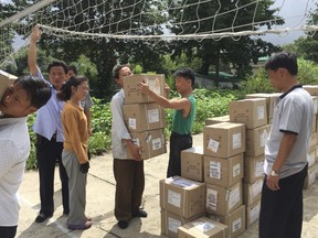 This image provided by Christian Friends of Korea shows Hepatitis B medicine, provided by the U.S.-based aid group, Christian Friends of Korea, is delivered to a health care center in the North Korean capital Pyongyang in August 2017. Sanctions against North Korea's government are intensifying, and the few aid groups operating in the country are facing bewildering economic restrictions and bureaucratic hurdles that could cripple life-saving work. (Christian Friends of Korea via AP)