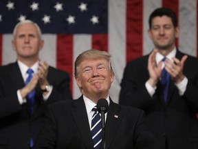 FILE - In this Feb. 28, 2017, file photo, President Donald Trump addresses a joint session of Congress on Capitol Hill in Washington, as Vice President Mike Pence and House Speaker Paul Ryan of Wis., applaud. President Trump's first state of the union speech will carry more suspense than most.